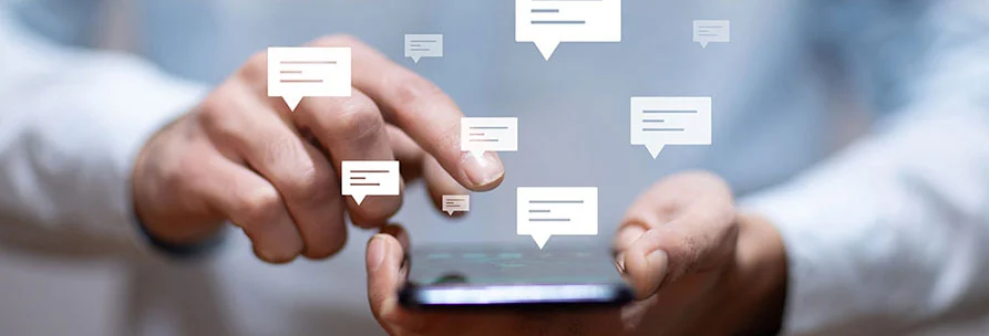 Men's Hand Holding Phone Has Messaging Symbols